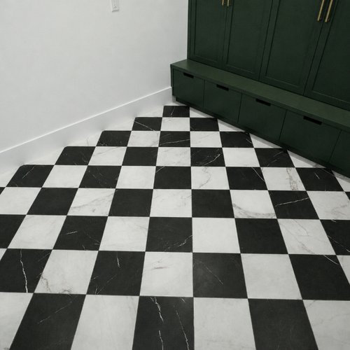 Vintage-look marble tile in a mudroom by DBG Flooring