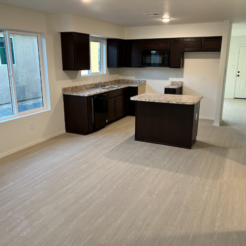 Yuma, AZ home with kitchen renovation featuring new laminate flooring by DBG Flooring